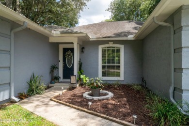 Fantastic pool home tucked away in a quiet Fort Caroline on Hidden Hills Country Club in Florida - for sale on GolfHomes.com, golf home, golf lot
