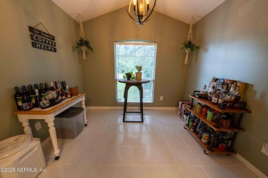 Fantastic pool home tucked away in a quiet Fort Caroline on Hidden Hills Country Club in Florida - for sale on GolfHomes.com, golf home, golf lot