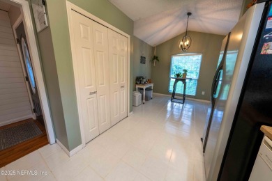 Fantastic pool home tucked away in a quiet Fort Caroline on Hidden Hills Country Club in Florida - for sale on GolfHomes.com, golf home, golf lot