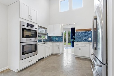 Welcome to this beautifully updated and modern 4-bedroom, 2 on Hamlet Country Club in Florida - for sale on GolfHomes.com, golf home, golf lot