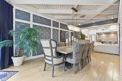 Welcome to this beautifully updated and modern 4-bedroom, 2 on Hamlet Country Club in Florida - for sale on GolfHomes.com, golf home, golf lot