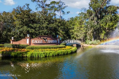 OPEN HOUSE SATURDAY MAY 31 FROM 10-1 STUNNING WATER-VIEW HOME on Eagle Harbor Golf Club in Florida - for sale on GolfHomes.com, golf home, golf lot