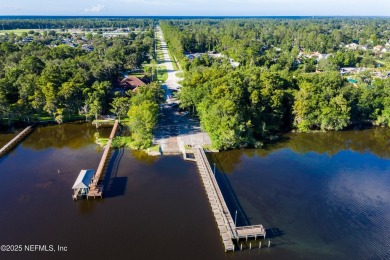 OPEN HOUSE SATURDAY MAY 31 FROM 10-1 STUNNING WATER-VIEW HOME on Eagle Harbor Golf Club in Florida - for sale on GolfHomes.com, golf home, golf lot