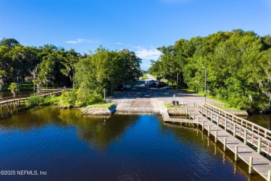 OPEN HOUSE SATURDAY MAY 31 FROM 10-1 STUNNING WATER-VIEW HOME on Eagle Harbor Golf Club in Florida - for sale on GolfHomes.com, golf home, golf lot