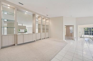 Don't miss this exceptional Divosta-built villa in highly on The Golf Club of Jupiter in Florida - for sale on GolfHomes.com, golf home, golf lot