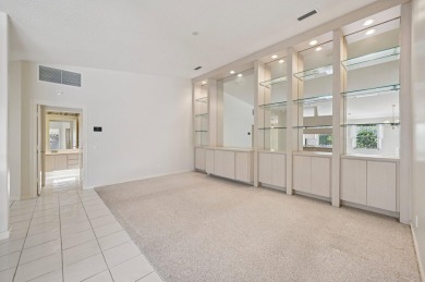Don't miss this exceptional Divosta-built villa in highly on The Golf Club of Jupiter in Florida - for sale on GolfHomes.com, golf home, golf lot
