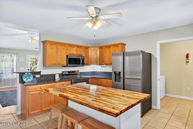 Ready to elevate your lifestyle and live the Oak Island dream? on Founders Club At St. James Plantation in North Carolina - for sale on GolfHomes.com, golf home, golf lot