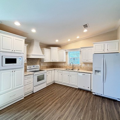 Welcome to Beach Cove, a vibrant 55+ manufactured home community on Pelican Pointe 9 Hole Course in Florida - for sale on GolfHomes.com, golf home, golf lot