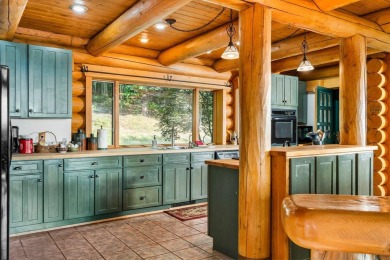 Welcome to this stunning Up North luxury log home perfectly on Boyne Mountain Resort - Monument Course in Michigan - for sale on GolfHomes.com, golf home, golf lot