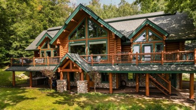 Welcome to this stunning Up North luxury log home perfectly on Boyne Mountain Resort - Monument Course in Michigan - for sale on GolfHomes.com, golf home, golf lot