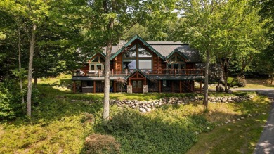 Welcome to this stunning Up North luxury log home perfectly on Boyne Mountain Resort - Monument Course in Michigan - for sale on GolfHomes.com, golf home, golf lot