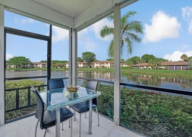 ABSOLUTELY STUNNING GROUND FLOOR CORNER UNIT! GORGEOUS BOTH on Boca Lago Golf and Country Club in Florida - for sale on GolfHomes.com, golf home, golf lot