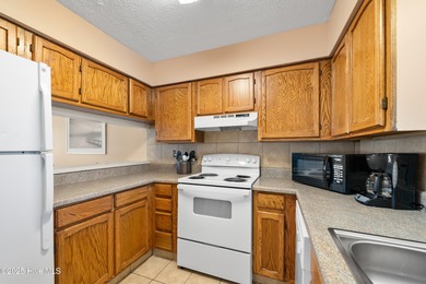 Your slice of paradise awaits! This tastefully furnished on Oak Island Golf Club in North Carolina - for sale on GolfHomes.com, golf home, golf lot