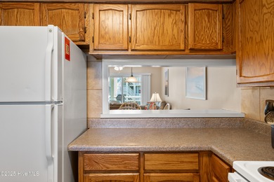 Your slice of paradise awaits! This tastefully furnished on Oak Island Golf Club in North Carolina - for sale on GolfHomes.com, golf home, golf lot