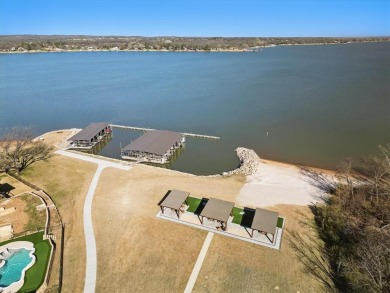 This home offers luxury living in a premier lake and golf on The Golf Club at Resort Eagle Mountain Lake in Texas - for sale on GolfHomes.com, golf home, golf lot