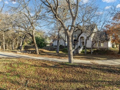 Discover luxury living in this expansive five-bedroom home on White Bluff Resort - Old Course in Texas - for sale on GolfHomes.com, golf home, golf lot