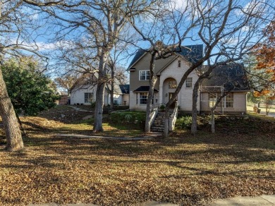 Discover luxury living in this expansive five-bedroom home on White Bluff Resort - Old Course in Texas - for sale on GolfHomes.com, golf home, golf lot