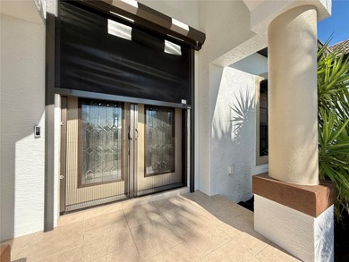 STUNNING MANICURED GOLF COURSE and TRANQUIL LAKE VIEWS await you on Saint Andrews South Golf Club in Florida - for sale on GolfHomes.com, golf home, golf lot