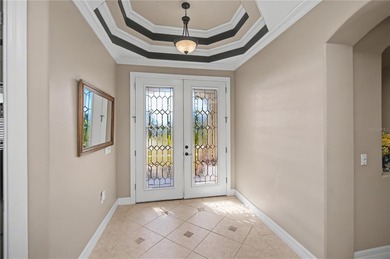 STUNNING MANICURED GOLF COURSE and TRANQUIL LAKE VIEWS await you on Saint Andrews South Golf Club in Florida - for sale on GolfHomes.com, golf home, golf lot