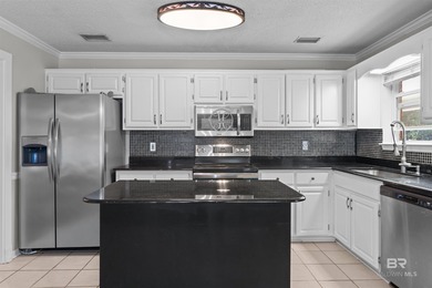 Welcome home to this 3 bedroom, 2 bath brick home with a bonus on Lake Forest Yacht and Country Club in Alabama - for sale on GolfHomes.com, golf home, golf lot