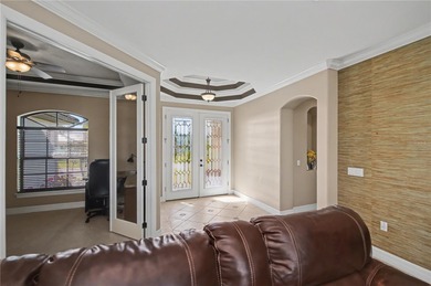 STUNNING MANICURED GOLF COURSE and TRANQUIL LAKE VIEWS await you on Saint Andrews South Golf Club in Florida - for sale on GolfHomes.com, golf home, golf lot