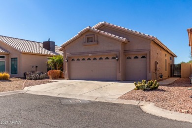 Nestled in the serene cul-de-sac of the prestigious Coyote Lakes on Coyote Lakes Golf Club in Arizona - for sale on GolfHomes.com, golf home, golf lot