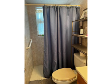 Spacious and beautiful 2-bedroom, 2-bathroom first-floor unit on Oriole Golf and Tennis Club in Florida - for sale on GolfHomes.com, golf home, golf lot