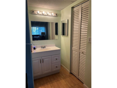 Spacious and beautiful 2-bedroom, 2-bathroom first-floor unit on Oriole Golf and Tennis Club in Florida - for sale on GolfHomes.com, golf home, golf lot