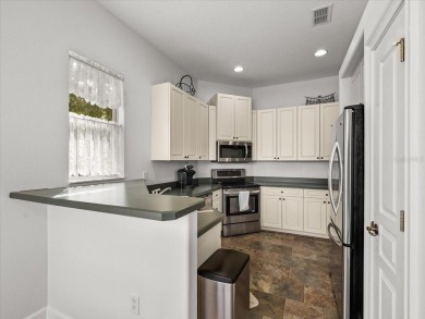 Located in Glen Lakes, this 2003 Addison Audubon maintenance on Glen Lakes Country Club in Florida - for sale on GolfHomes.com, golf home, golf lot