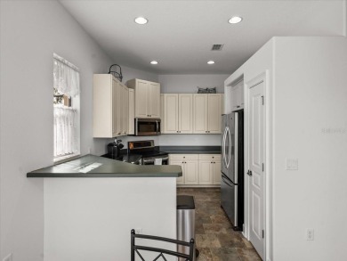 Located in Glen Lakes, this 2003 Addison Audubon maintenance on Glen Lakes Country Club in Florida - for sale on GolfHomes.com, golf home, golf lot