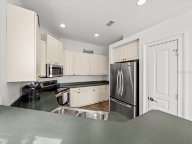 Located in Glen Lakes, this 2003 Addison Audubon maintenance on Glen Lakes Country Club in Florida - for sale on GolfHomes.com, golf home, golf lot