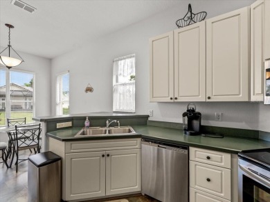 Located in Glen Lakes, this 2003 Addison Audubon maintenance on Glen Lakes Country Club in Florida - for sale on GolfHomes.com, golf home, golf lot