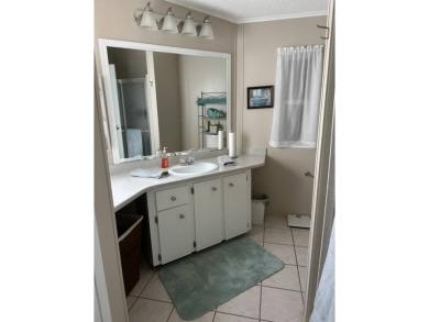 Welcome to this charming and meticulously maintained 2-bedroom on Schalamar Creek Golf and Country Club in Florida - for sale on GolfHomes.com, golf home, golf lot
