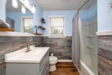 Enjoy boating, fishing & swimming from this recently renovated on Players Course At Wyboo Plantation in South Carolina - for sale on GolfHomes.com, golf home, golf lot