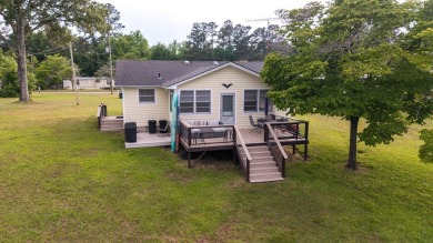 Enjoy boating, fishing & swimming from this recently renovated on Players Course At Wyboo Plantation in South Carolina - for sale on GolfHomes.com, golf home, golf lot