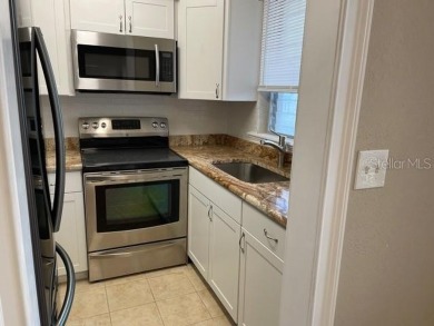 GOLF  BEACH LOVERS LIVE, WORK,  PLAY! 1 BR NEWLY REMODELED MOVE on Clearwater Country Club in Florida - for sale on GolfHomes.com, golf home, golf lot