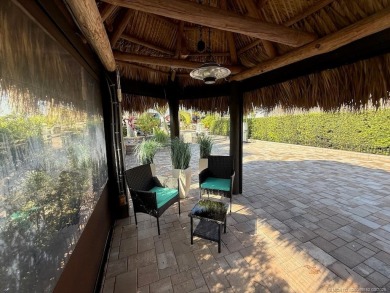 Welcome to this enchanting waterfront & golf-front tiki Lot! on Motorcoach Resort Golf Course in Florida - for sale on GolfHomes.com, golf home, golf lot