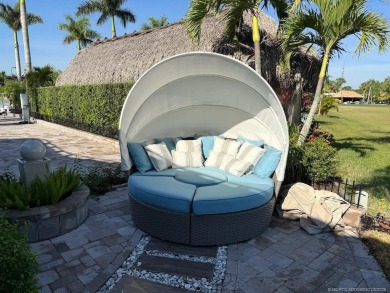 Welcome to this enchanting waterfront & golf-front tiki Lot! on Motorcoach Resort Golf Course in Florida - for sale on GolfHomes.com, golf home, golf lot