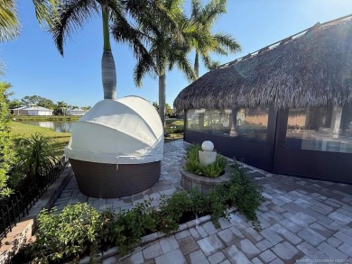 Welcome to this enchanting waterfront & golf-front tiki Lot! on Motorcoach Resort Golf Course in Florida - for sale on GolfHomes.com, golf home, golf lot