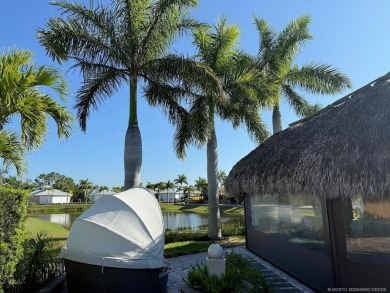 Welcome to this enchanting waterfront & golf-front tiki Lot! on Motorcoach Resort Golf Course in Florida - for sale on GolfHomes.com, golf home, golf lot