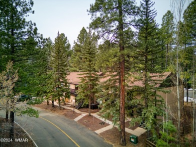 A perfect mountain retreat! This upper floor end unit features on Pinetop Lakes Golf and Country Club in Arizona - for sale on GolfHomes.com, golf home, golf lot