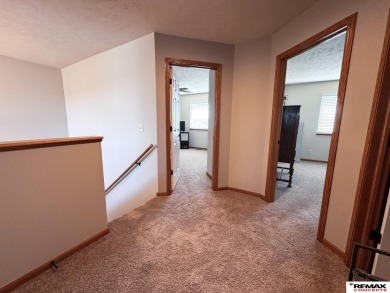 This home is sure to impress! Welcome to this 4-bedroom, 3 on Mahoney Golf Course in Nebraska - for sale on GolfHomes.com, golf home, golf lot