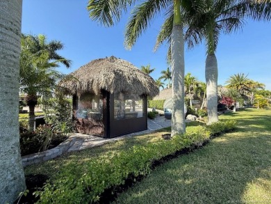 Welcome to this enchanting waterfront & golf-front tiki Lot! on Motorcoach Resort Golf Course in Florida - for sale on GolfHomes.com, golf home, golf lot