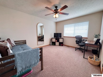 This home is sure to impress! Welcome to this 4-bedroom, 3 on Mahoney Golf Course in Nebraska - for sale on GolfHomes.com, golf home, golf lot