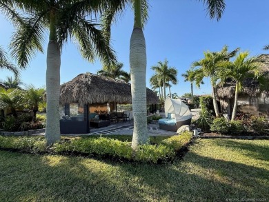 Welcome to this enchanting waterfront & golf-front tiki Lot! on Motorcoach Resort Golf Course in Florida - for sale on GolfHomes.com, golf home, golf lot