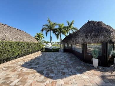 Welcome to this enchanting waterfront & golf-front tiki Lot! on Motorcoach Resort Golf Course in Florida - for sale on GolfHomes.com, golf home, golf lot