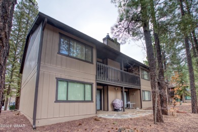 A perfect mountain retreat! This upper floor end unit features on Pinetop Lakes Golf and Country Club in Arizona - for sale on GolfHomes.com, golf home, golf lot