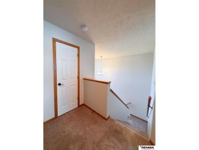 This home is sure to impress! Welcome to this 4-bedroom, 3 on Mahoney Golf Course in Nebraska - for sale on GolfHomes.com, golf home, golf lot