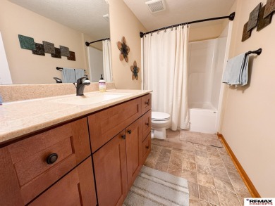 This home is sure to impress! Welcome to this 4-bedroom, 3 on Mahoney Golf Course in Nebraska - for sale on GolfHomes.com, golf home, golf lot