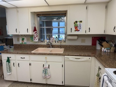 Wonderful Montgomery unit with combo living room, dining room on On Top of the World Golf Course in Florida - for sale on GolfHomes.com, golf home, golf lot